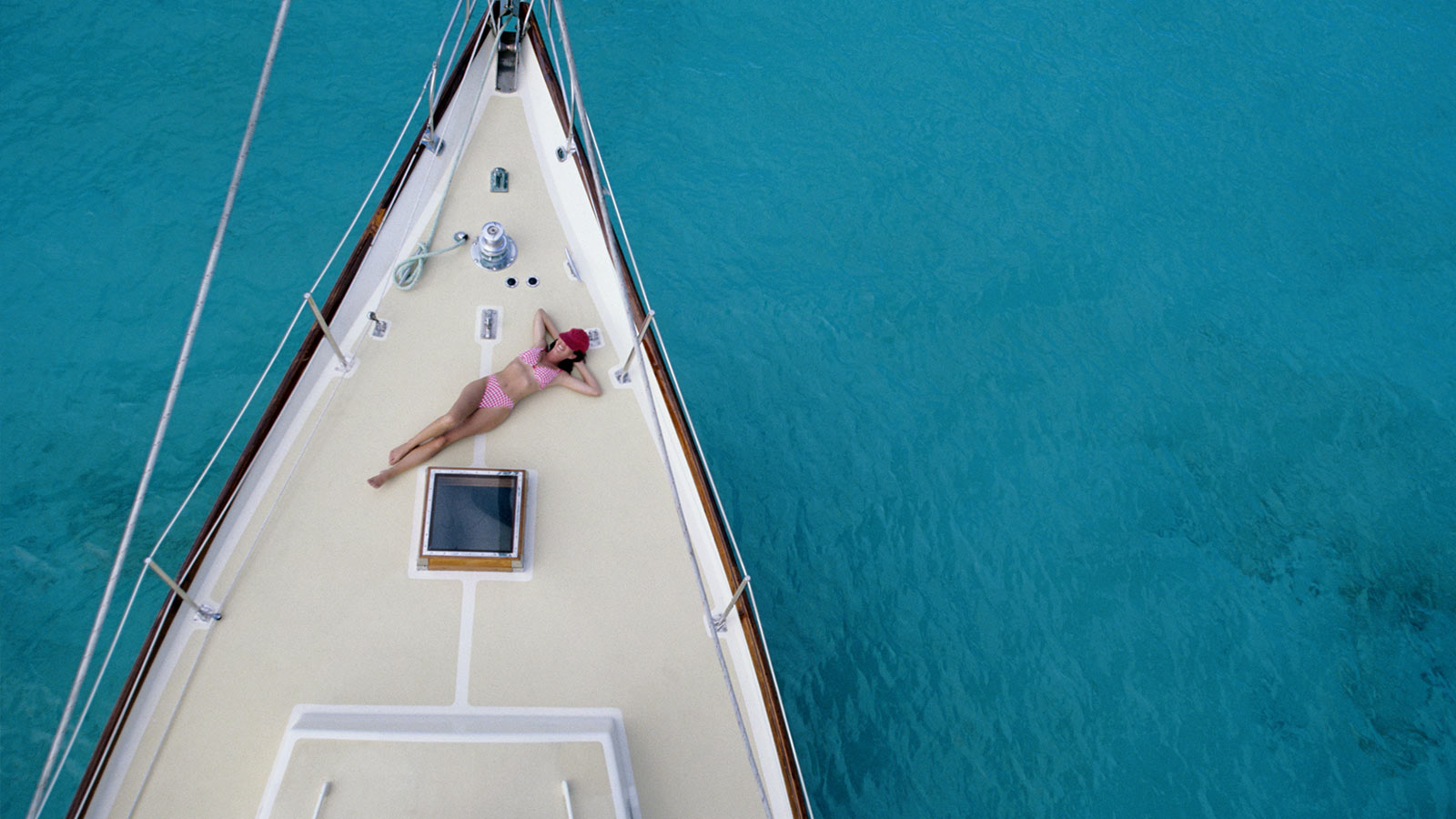 woman sunbathing on a yacht